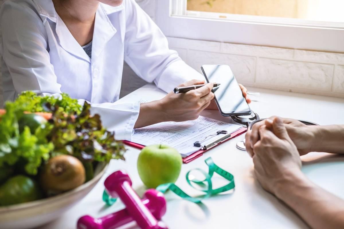 Registered dietitian reviewing a nutrition and exercise plan with a patient